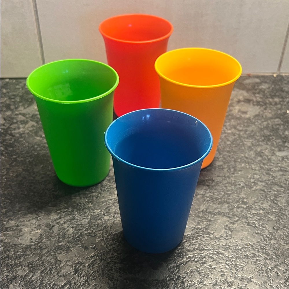 Set of 4 -7 oz Colorful Plastic Cups by Tupperware. Seem brand new.